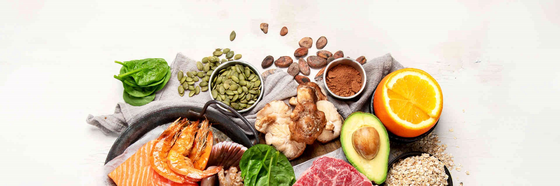 Selection of zinc-rich foods such as seafood and avocado