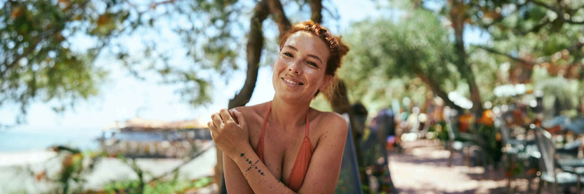 Woman with freckles in the sunshine