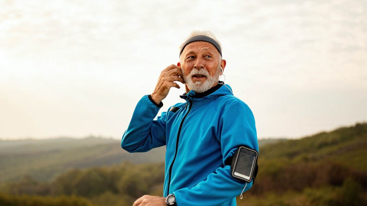 Older man out for a run on a heath